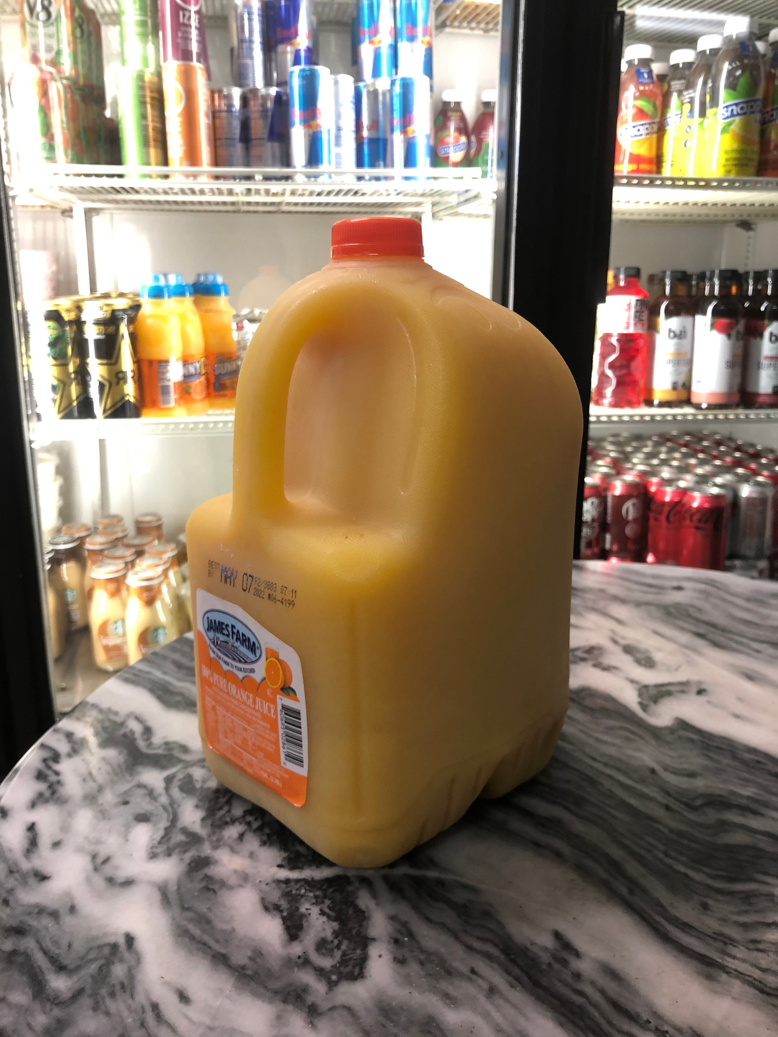 Gallon of shop orange juice